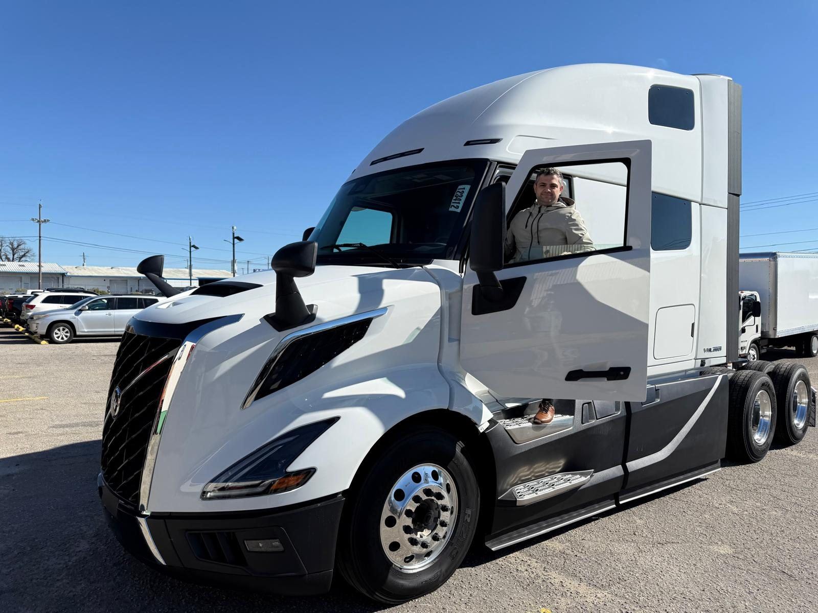 DNL Trucking driver in a Volvo VNL sleeper
